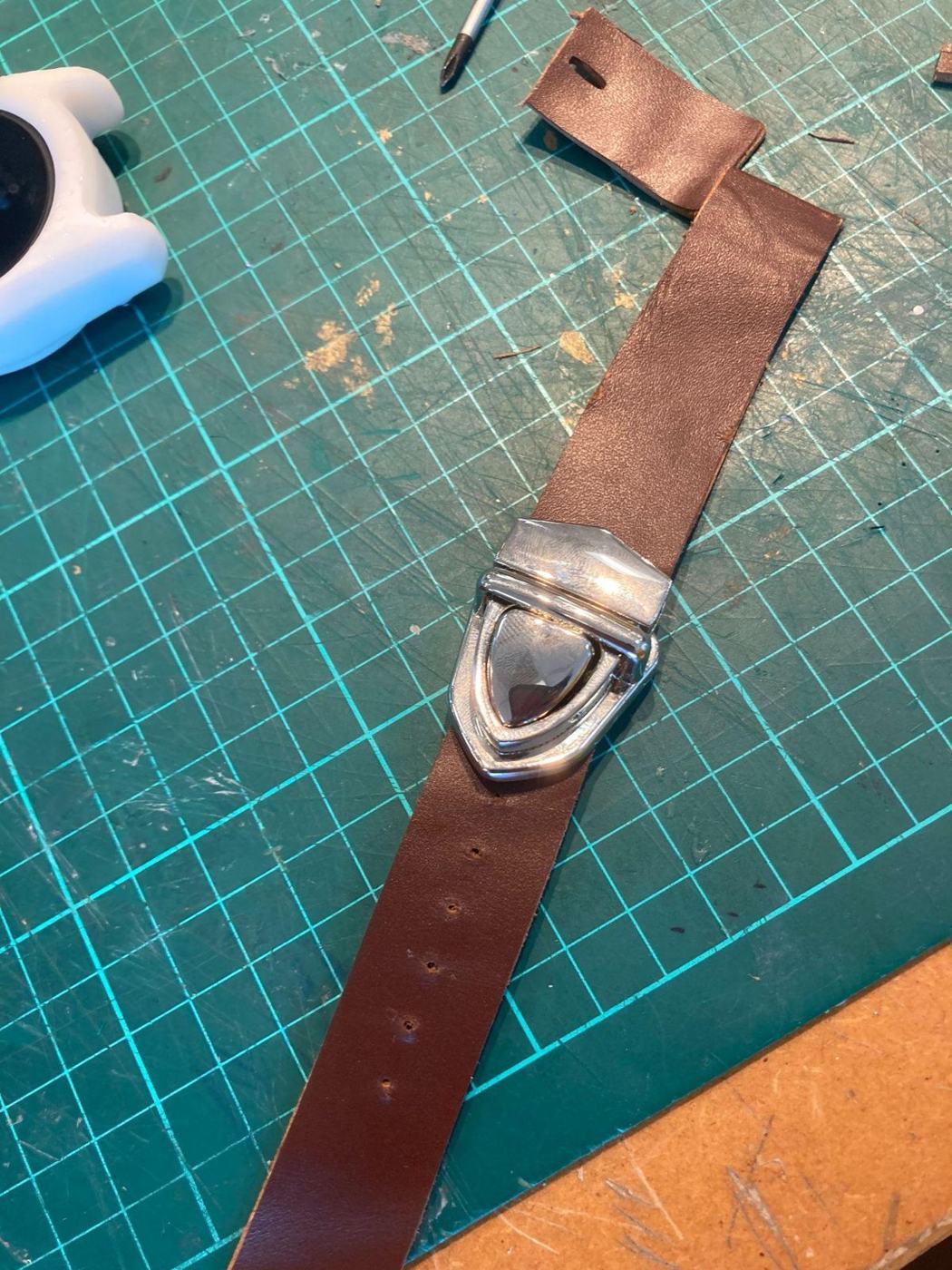 Leather strap on a cutting mat